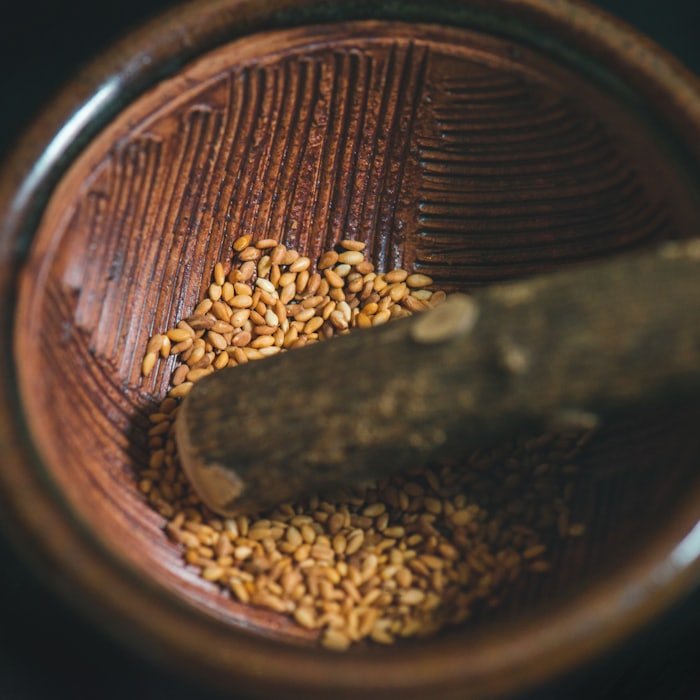 Sesame seeds in a wooden mortar
