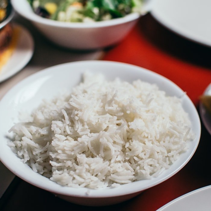 A bowl of cooked basmati rice, grains separate and elongated