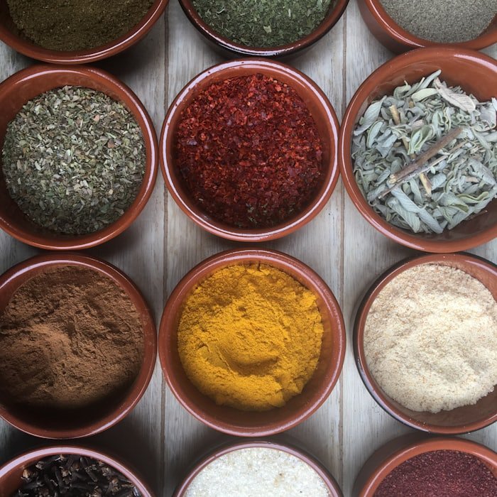 Ground spice powders in terracotta bowls
