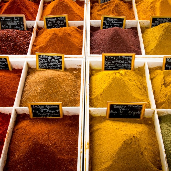 Ground spice blends displayed in market trays