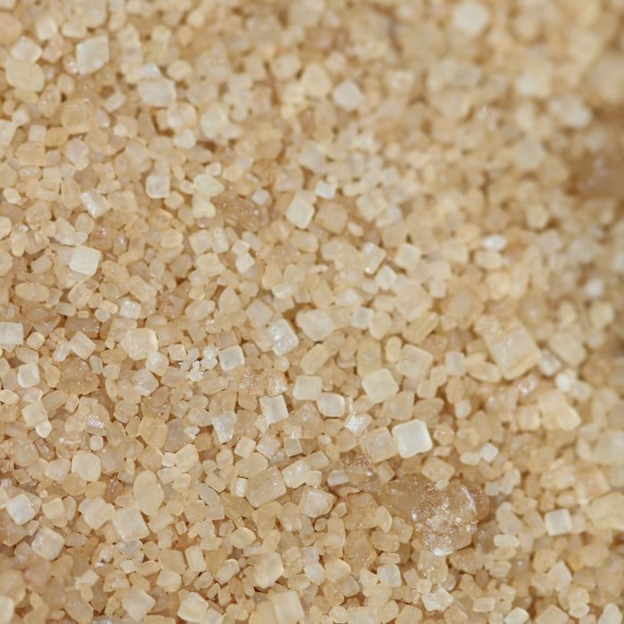 Close-up of raw brown cane sugar crystals