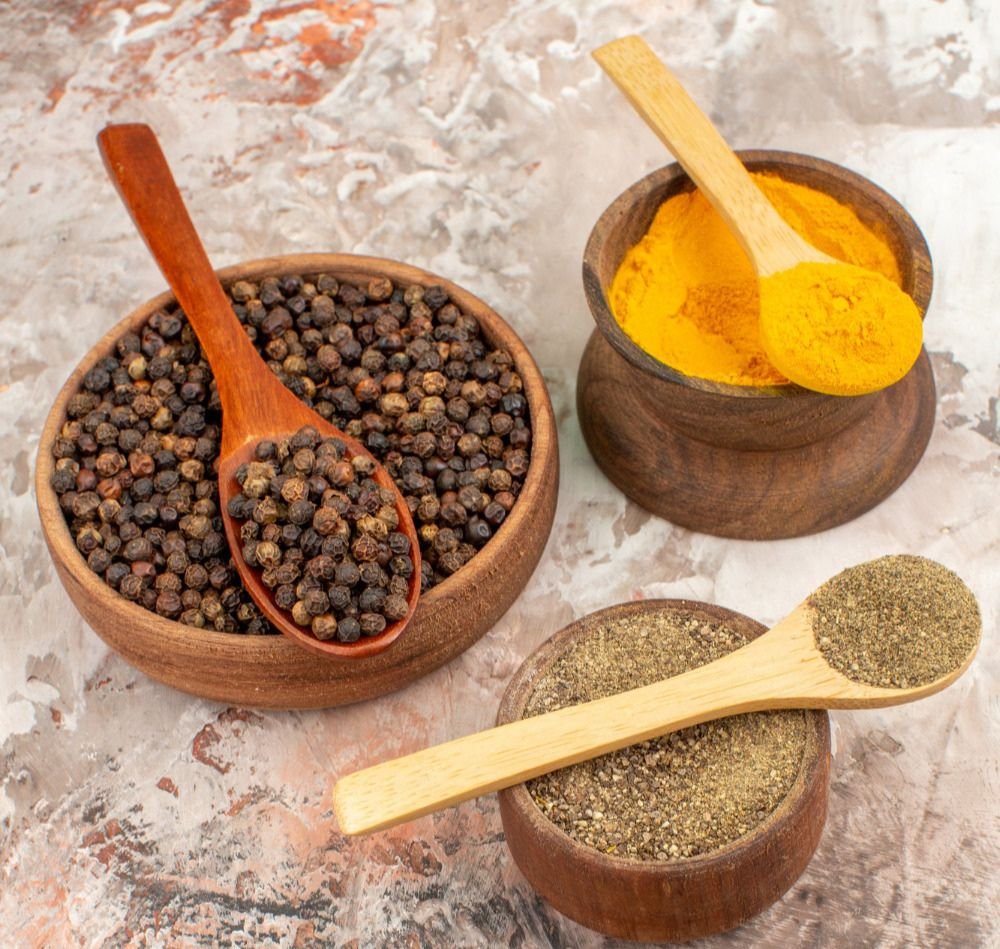 Graded whole spices in wooden bowls at the Verdura facility